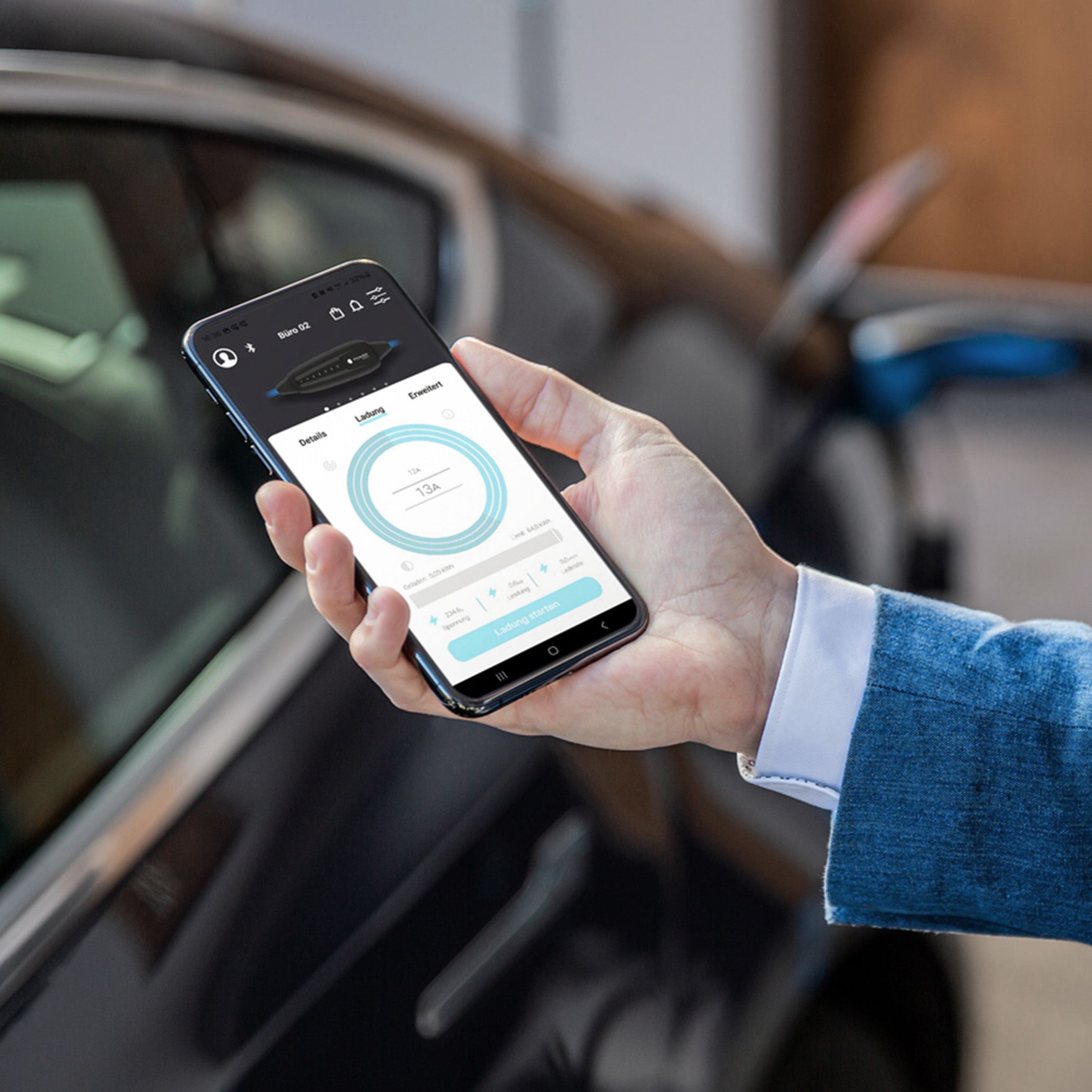 Person holding mobile phone with display on